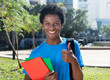 Young african american male student showing thumb