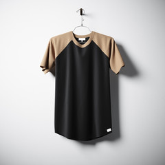 Sticker - Blank cotton tshirt of brown and black colors hanging in center empty concrete wall. Clear label mockup with highly detailed texture materials. Square. Front side view. 3D rendering.