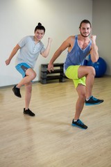 Wall Mural - Portrait of two men doing aerobic exercise