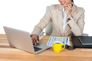 Poster - Businesswoman working at her desk in office