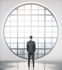 Aufkleber - Businessman looking out of window