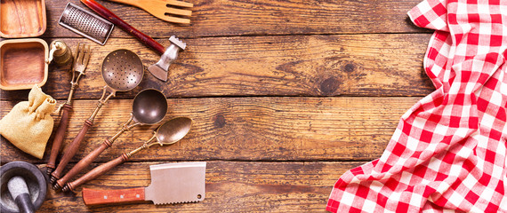 Wall Mural - Various kitchen utensils on wooden table