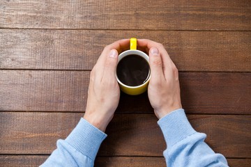 Poster - Man holding a cup of coffee