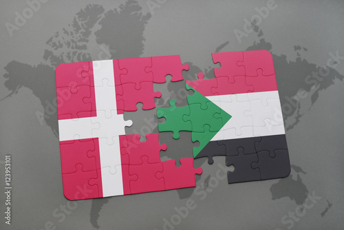 Photo puzzle with the national flag of denmark and sudan on a world map background
