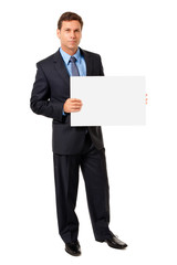 Wall Mural - Full-length male man businessman holding blank sign isolated on white background