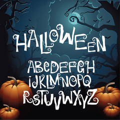 Halloween hand drawn creepy curly font alphabet with bonus jack-o-lantern and scary tree background. EPS 10 vector.