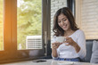 © sunti - Beautiful young woman with morning coffee
