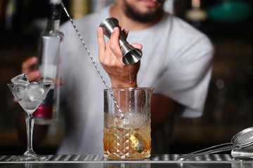 Poster - Barman preparing cocktail on bar counter