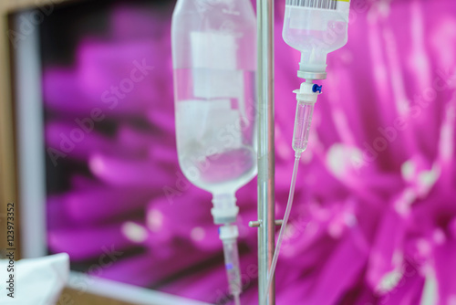 Close up IV saline solution drip for patient in hospital Poster
