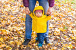 © satura_ - Father and his little son having fun in autumn park