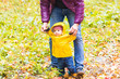 © satura_ - Father and his little son having fun in autumn park
