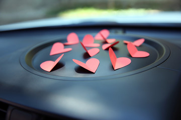 Wall Mural - Paper hearts on car dashboard