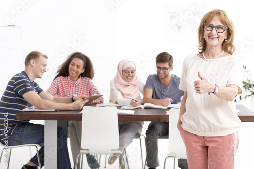 Satisfied teacher standing with the thumb up Canvas