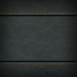 Texture of grey leather background with stitched seam, close-up. Texture for design.