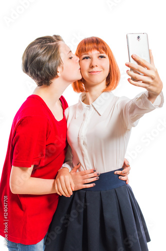 Two Lesbian Girls Hugging She Takes Selfie Kiss On The Cheek On White 