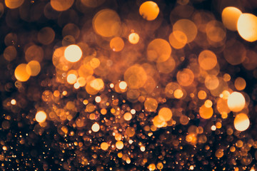 gold bokeh on dark background
