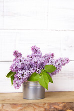Lilac Flowers On White Wooden Background
