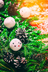 Wall Mural - New year's background.Real fir branches and Spruce cones.White Christmas balls.