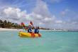 © Designpics - Two Women In Lifejackets Paddling In A Yellow Boat; Punta Cana, La Altagracia, Dominican Republic