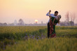 © Designpics - Portrait Of A Mixed Race Couple Her Wearing A Sari In A Field At Sunset; Ludhiana, Punjab, India
