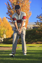 A Man Golfing At Lynnwood Golf Course; Lynnwood,Washington, United States Of America