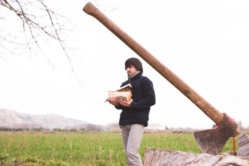 man chopping wood with an ax