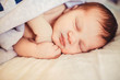 © pyrozenko13 - Incredible and sweet newborn baby sleeps on the bed