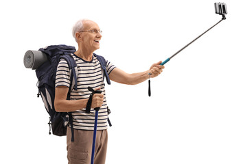 Sticker - Elderly male hiker taking a selfie with a stick