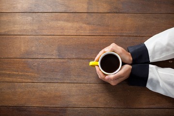 Woman holding a cup of coffee