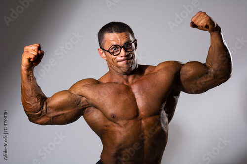 Leinwand Poster Happy muscular man with a naked torso