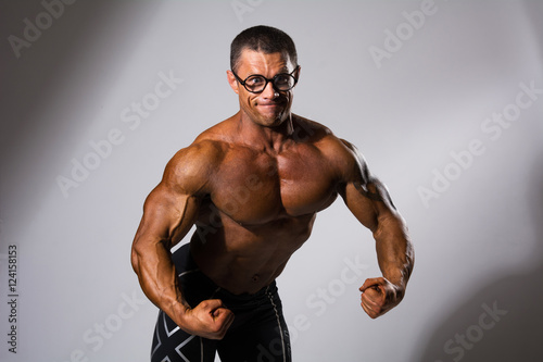 Happy muscular man with a naked torso Fototapete