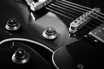 Acoustic guitar close up in dark background