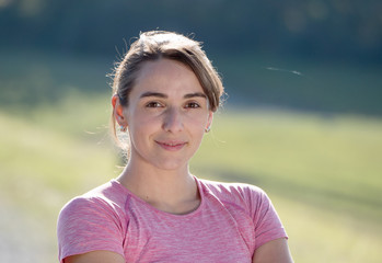 portrait of young sporty woman in the countryside