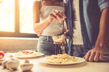 Wall Mural - Young couple in kitchen