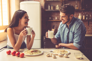 Wall Mural - Young couple in kitchen