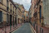 Fototapeta Uliczki - Street with old buildings in Toulouse