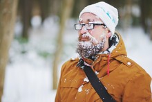 Beard Man In Eyeglasses Covered By Snow Enjoying Cold Weather.