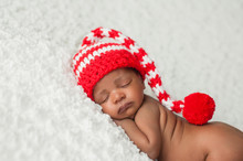 Baby Wearing A Christmas Stocking Cap