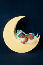 Newborn Baby Girl Sleeping On The Moon