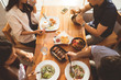 © torwaiphoto - Asian people having breakfast in a restaurant.top view