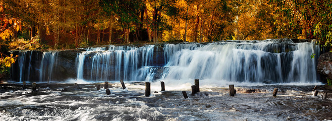 Wall Mural - Tropical rainforest landscape with flowing Kulen waterfall in Cambodia. Two images panorama