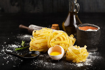 Canvas Print - Raw pasta and ingredients for pasta