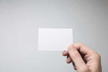 Hand holding Blank Business Card Mock-up.