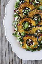 Roasted Acorn Squash Salad With Spicy Pepitas And Cranberries