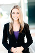 © Eric Hood - Attractive young businesswoman saleswoman reprepresentative real estate agent outdoor headshot business portrait