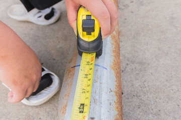 tape measure on steel background