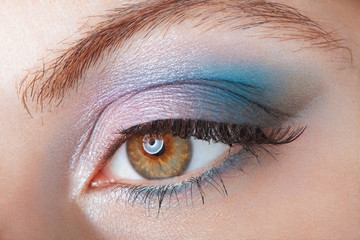 Woman with blue eye smokey beauty make up