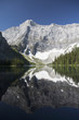 © Designpics - Mountain reflecting in mountain lake with snow and blue sky in kananaskis provincial park;Alberta canada