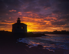 The Sun Rises Behind The Coquille River Lighthouse; Bandon, Oregon, United States Of America