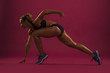© serhii - Young fitness woman preparing for a run. Fit female athlete ready for a sprint. Isolated